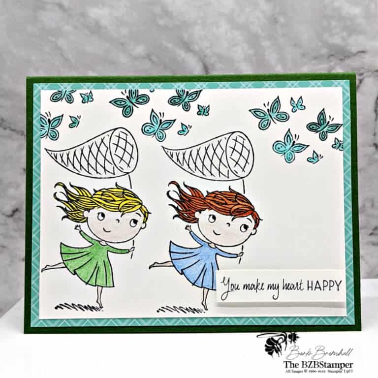 2 girls catching butterflies using Stampin 'Up! supplies