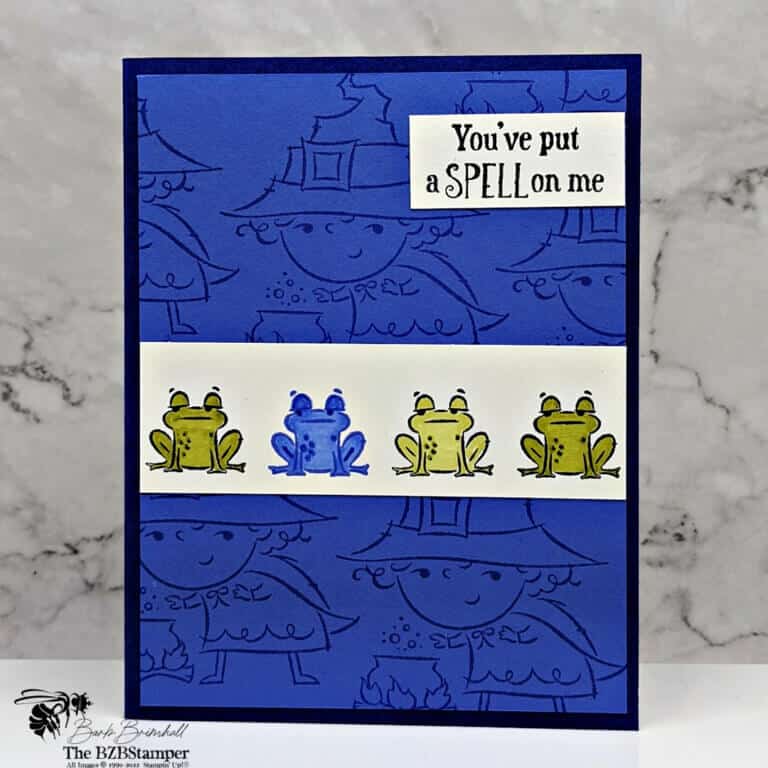 handmade Halloween card featuring frogs in purple and green