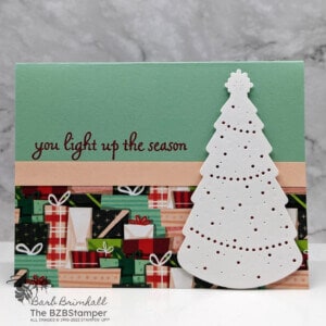 Handmade Christmas Greeting Card featuring paper with presents and tree