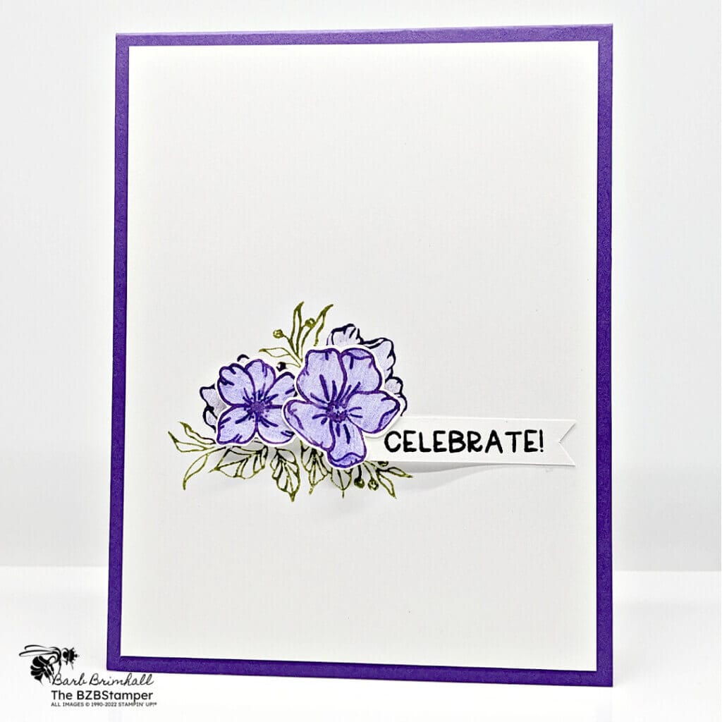 Handmade greeting card with purple flowers.