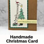 The Festive & Fun Stamp Set by Stampin' Up! with a cute giraffe putting a star on a Christmas tree with different colors. Sentiment is Happy Christmas Wishes.