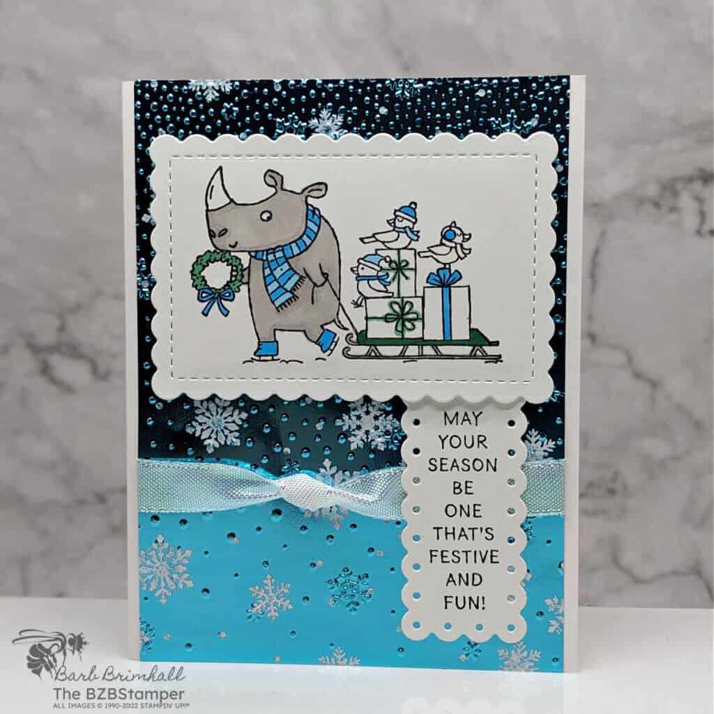 Christmas Card using the Festive and Fun Stamp Set by Stampin' Up!  Features a rhino with packages and birds on a sled.