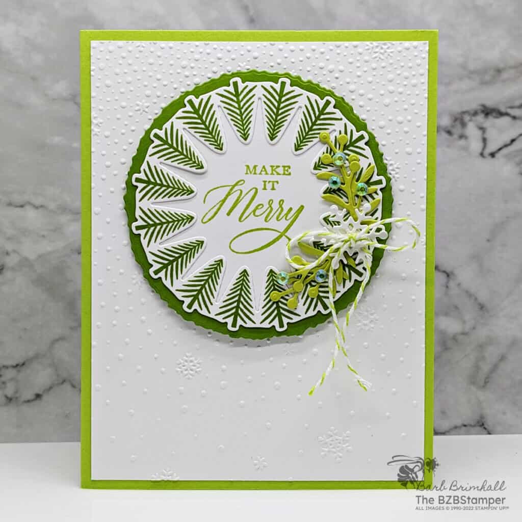 Wishes All Around Bundle by Stampin' Up! featuring a circle wreath of tree images and the "make it merry" sentiment.  Also includes diecut sprigs and a snowflake background.