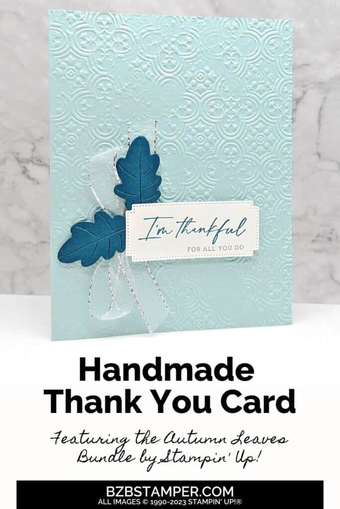 Handmade Thank You Card Tutorial in blues with 2 blue leaves and silver ribbon. Sentiment is "I'm thankful for all you do."