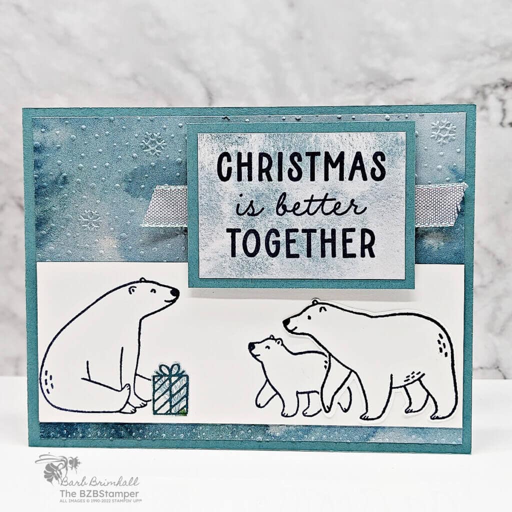 Beary Cute Bundle by Stampin Up featuring a card with pretty paper in shades of blue, 3 polar bears and a present.  Sentiment is "Christmas is better together."
