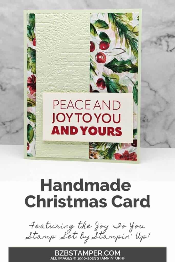 Joy To You Stamp Set by Stampin Up featuring pretty paper with green holly leaves and red berries. Sentiment is "peace and joy to you and yours."