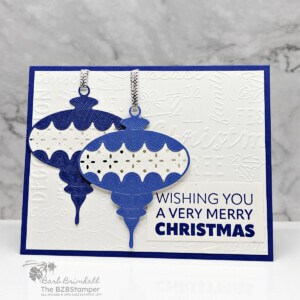 Good Tidings with the Joy To You Stamp Set by Stampin' Up! featuring 2 ornaments in different shades of blue with a Wishing You A Very Merry Christmas sentiment in blue.