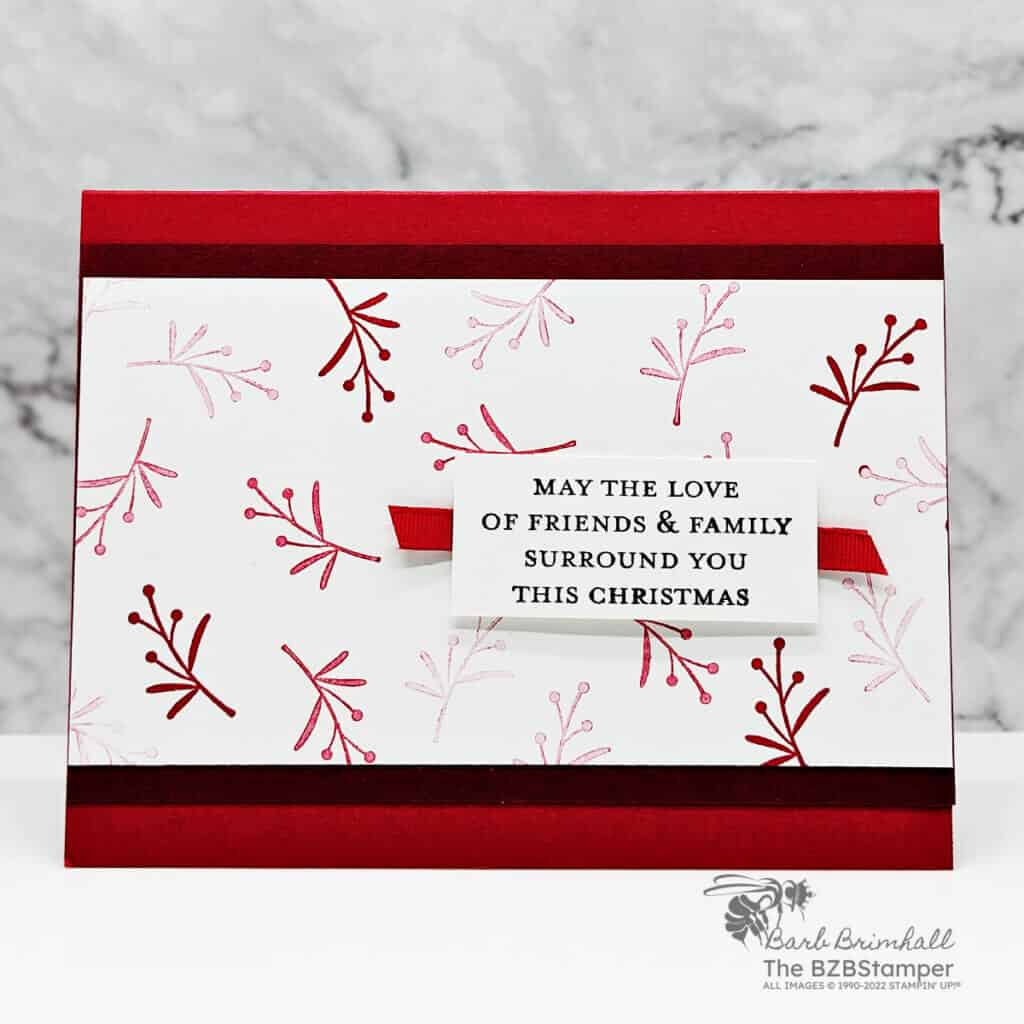 Wishes All Around Stamp Set by Stampin' Up! in different reds featuring branch images with a sentiment May The Love Of Friends & Family Surround you this Christmas