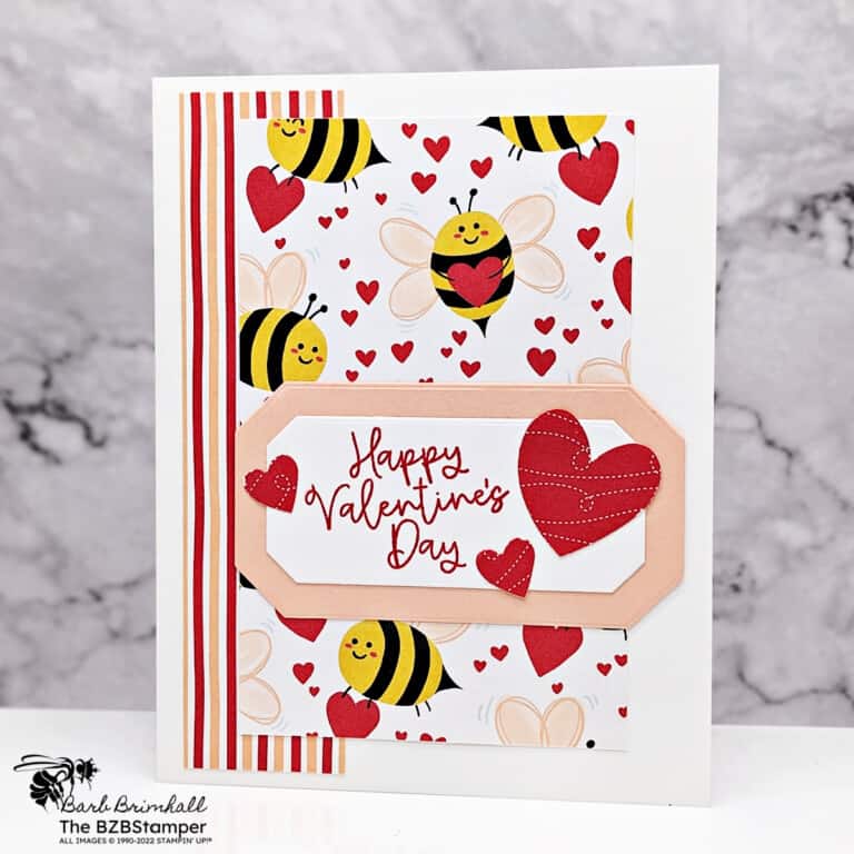 Handmade Valentine's Day Card using the Bee My Valentine Stamp Set by Stampin Up! Features pretty bee paper, red hearts, and with bee images and a Happy Valentine's Day sentiment in red ink.