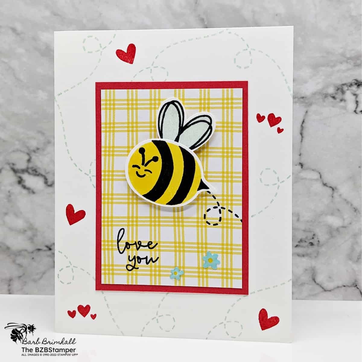 Bee My Valentine Bundle by Stampin Up featuring a bee that says "I love you" in red, blue and yellow with red hearts.
