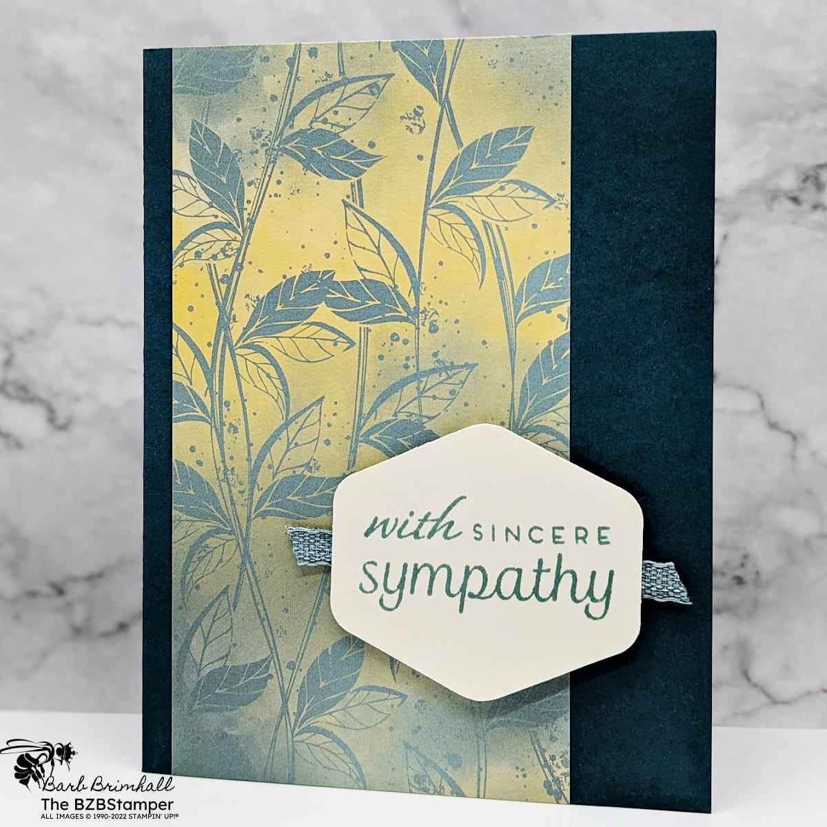 Sympathy Card Using The Heartfelt Hexagon Bundle in varying shades of green and yellow.  Uses a punched sentiment that says "with sincere sympathy" and the paper features beautiful leaves.