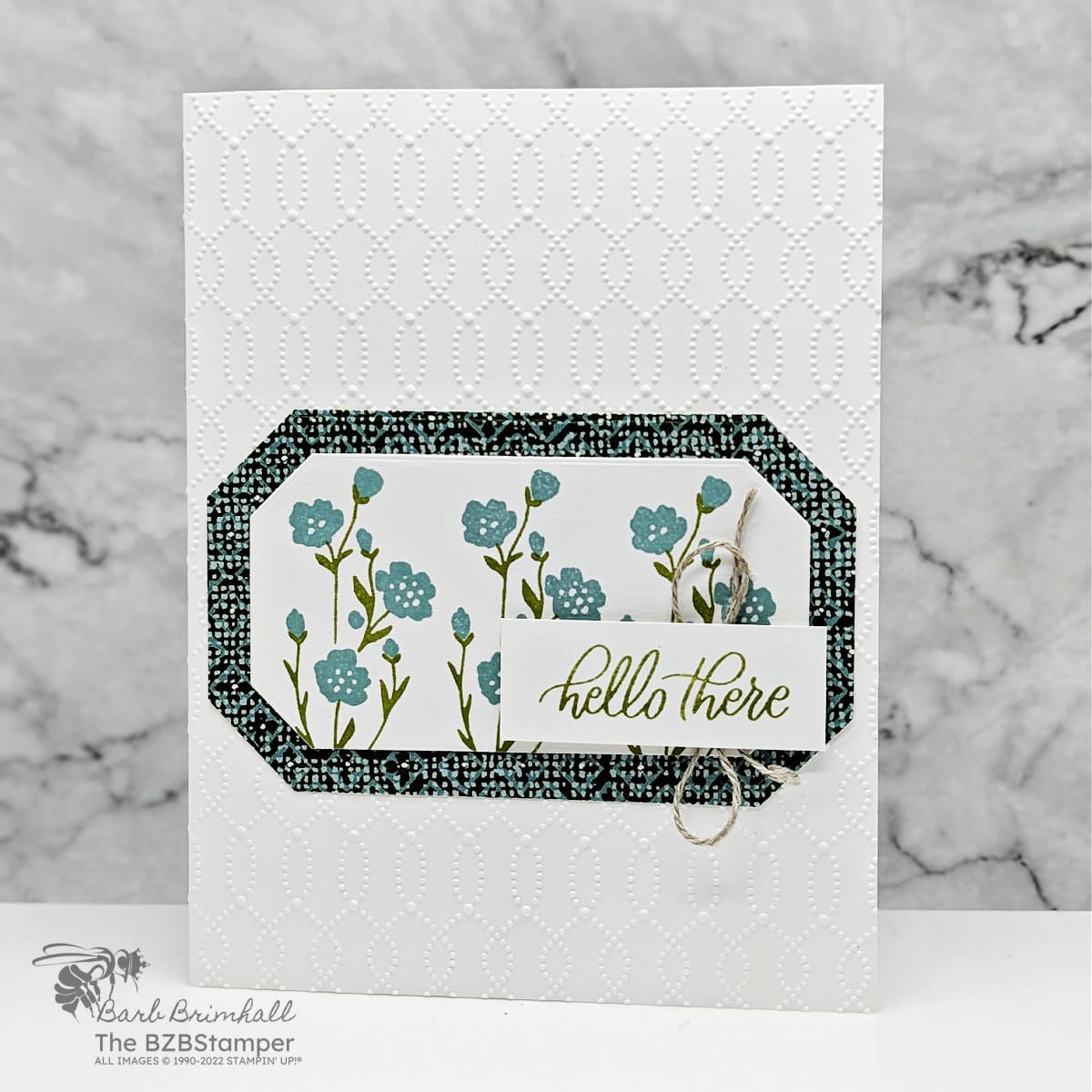 Two-Step Stamping with the Softly Sophisticated Bundle in blues and greens with an embossed background, flowers and a "hello there" sentiment.