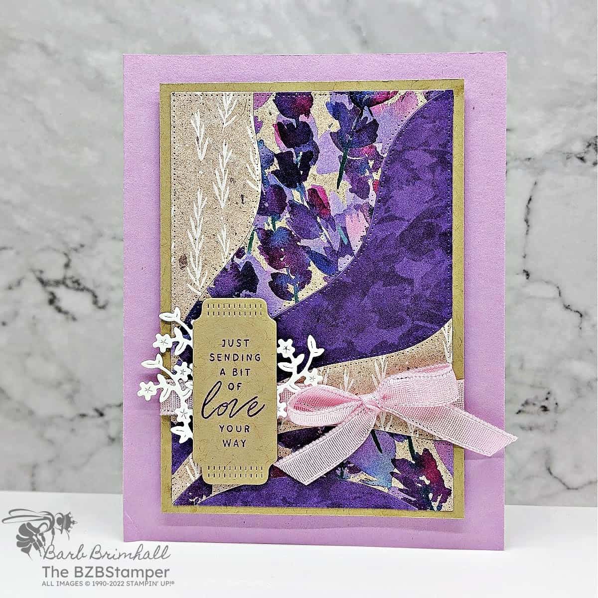 Thinking of You Card using Lovely and Sweet Bundle in a variety of purples and kraft colors.  Sentiment is "just sending a bit of love your way" making it a great all-occasion card.