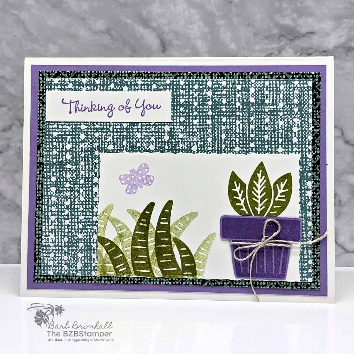 Planted Paradise Thinking of You Handmade Card in green and purple with pretty paper, a butterfly and a potted plant with foliage.