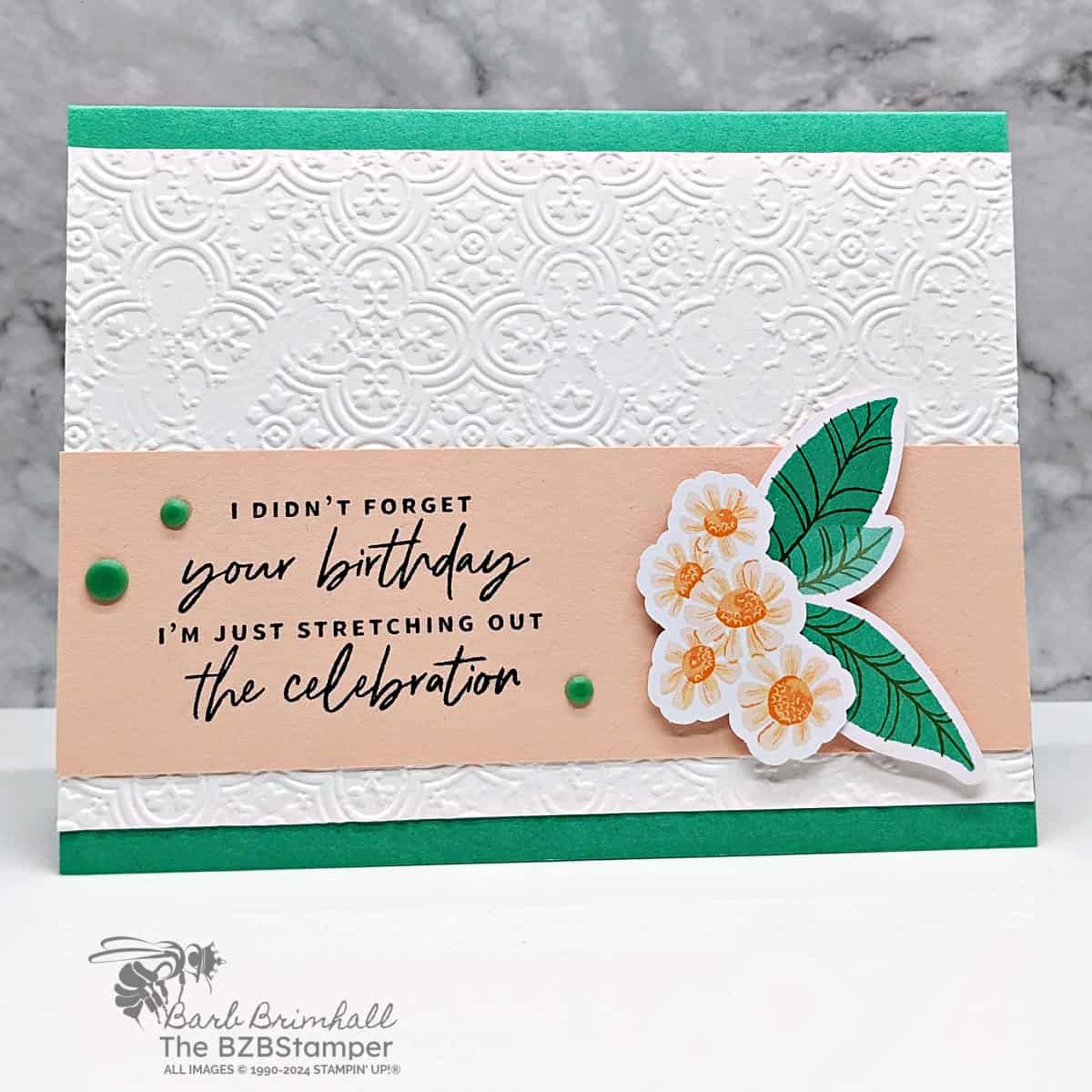 Belated Birthday Card Using The Something Fancy Stamps in greens and pinks with a floral image and dry embossed background.