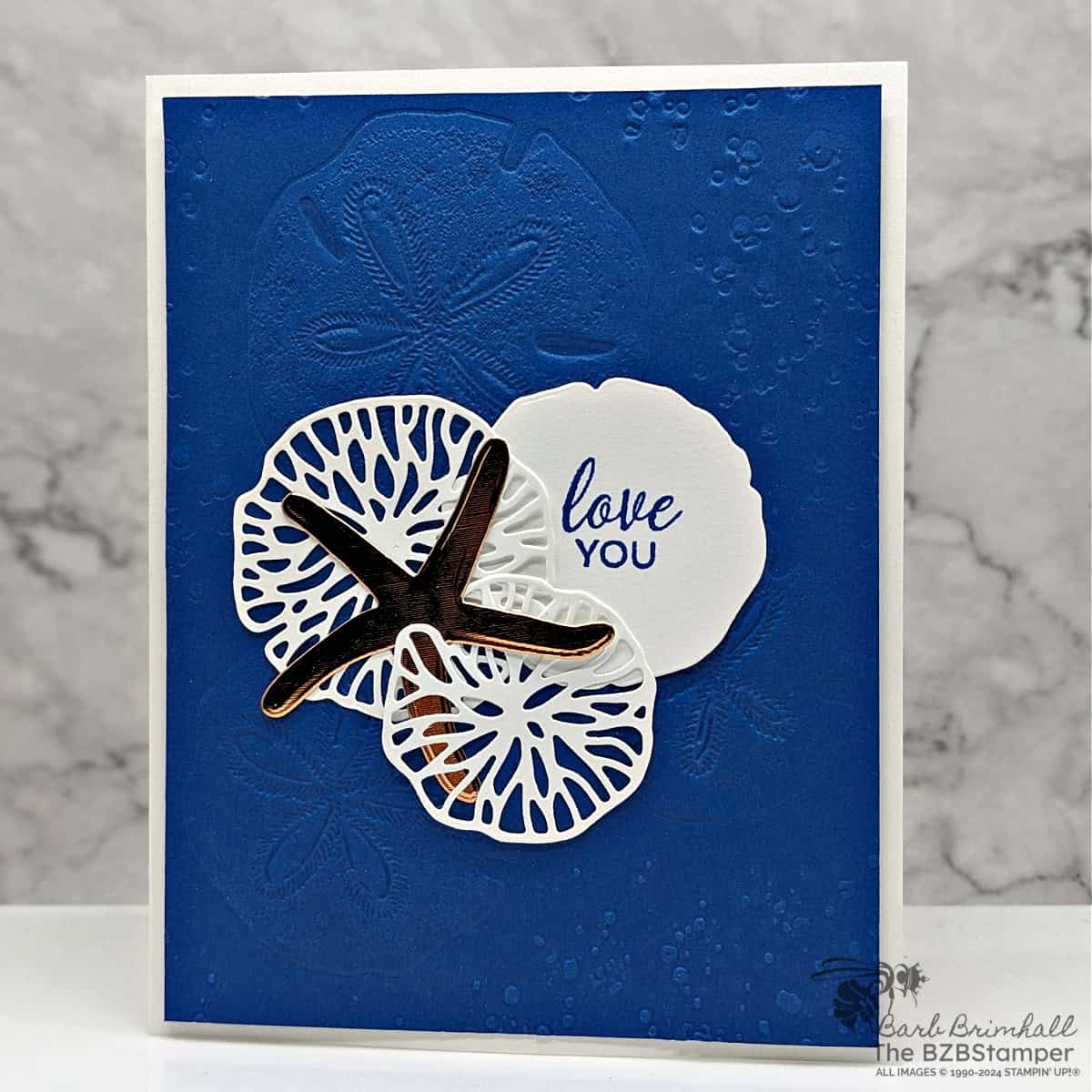 Seaside Wishes Love You Card in blue and copper, featuring seashells and an embossed background.