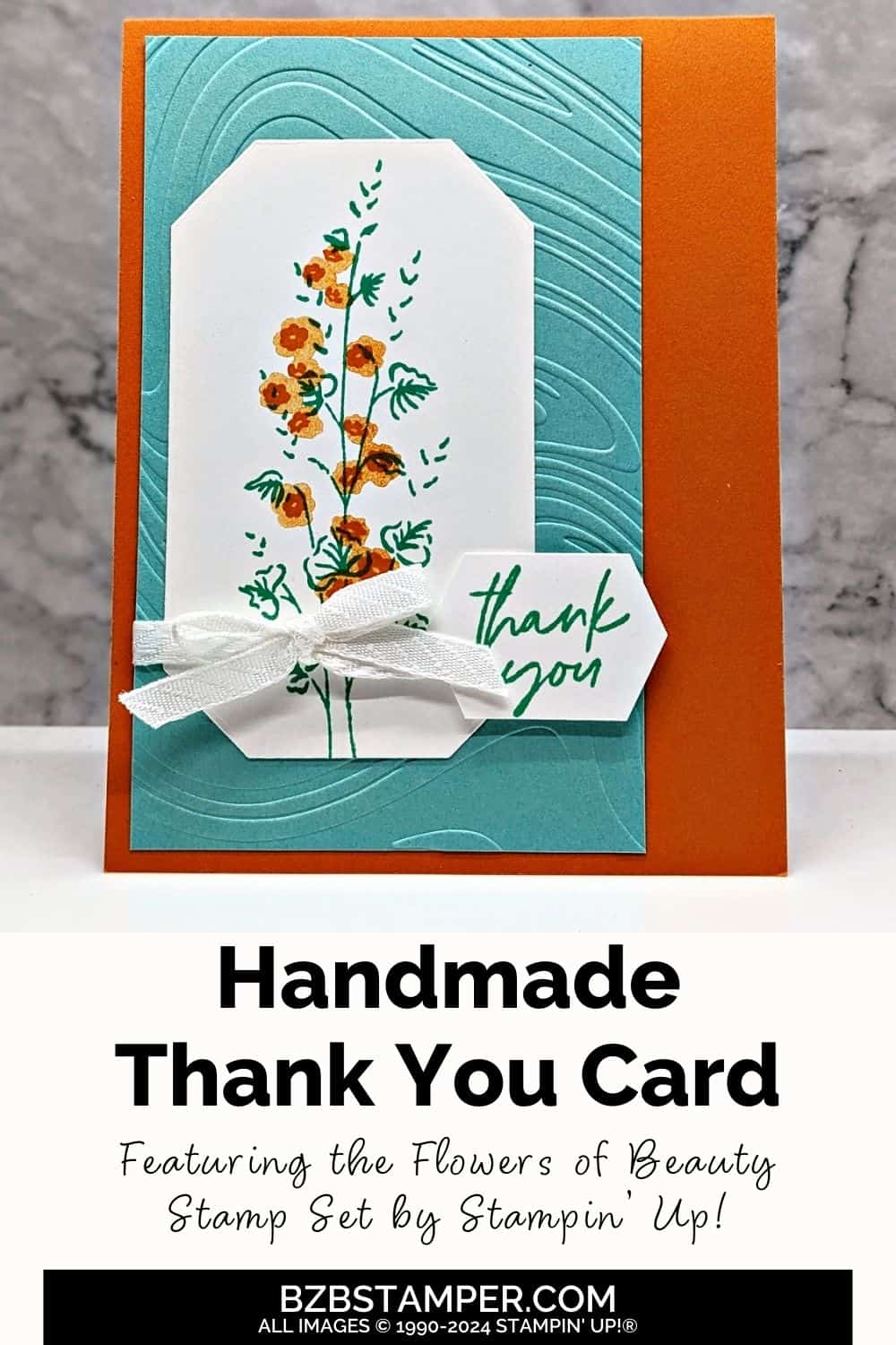 Flowers of Beauty Thank You Card in aqua and orange with a single flower stem, an embossed background and a thank you sentiment.
