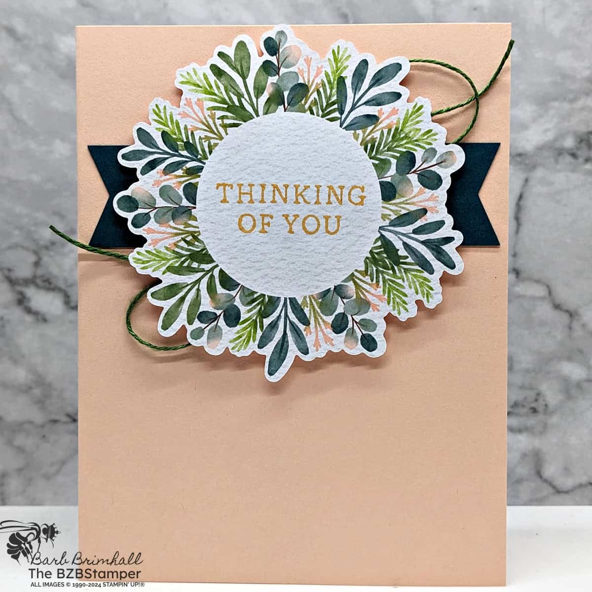 5 Minute Thinking of You Card Using Card Sketch 10.  Features a wreath with the sentiment in the center circle in colors of light pink and dark green.