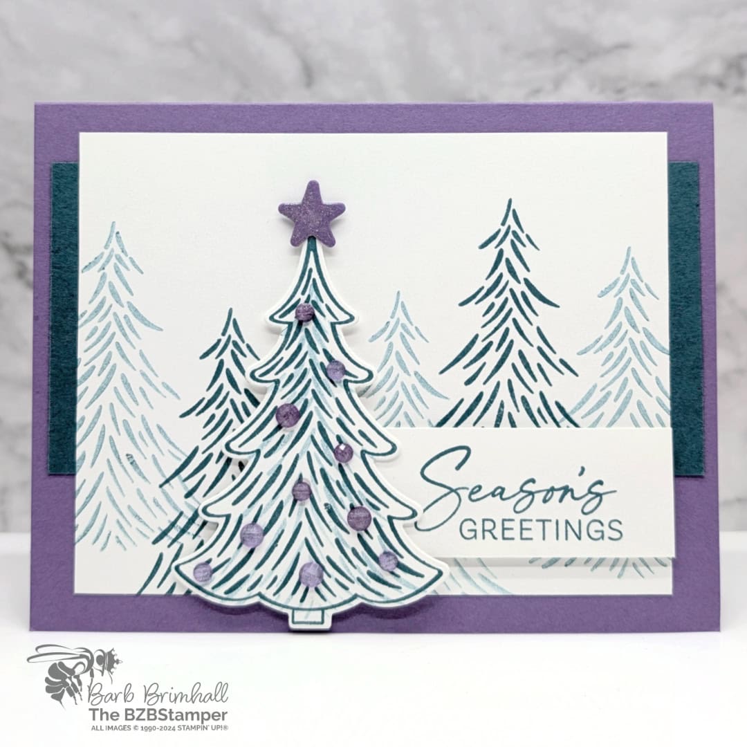 Season's Greetings with the Decorative Trees Bundle featuring several fir trees in green-blue and purple accents and a "season's greetings" sentiment.