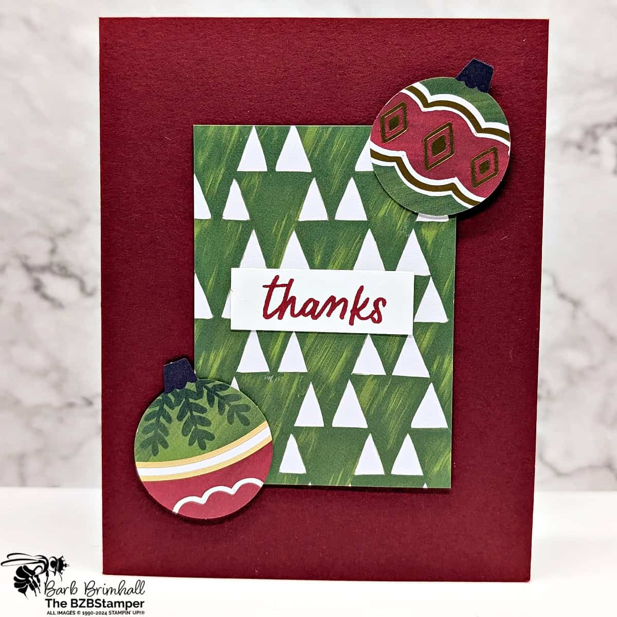 5 Minute Thank You Card using Holiday Card Sketch 6 featuring whimsical designer paper and 2 die-cut ornaments from the same paper.  Colors are burgundy and green and the sentiment is "thanks".