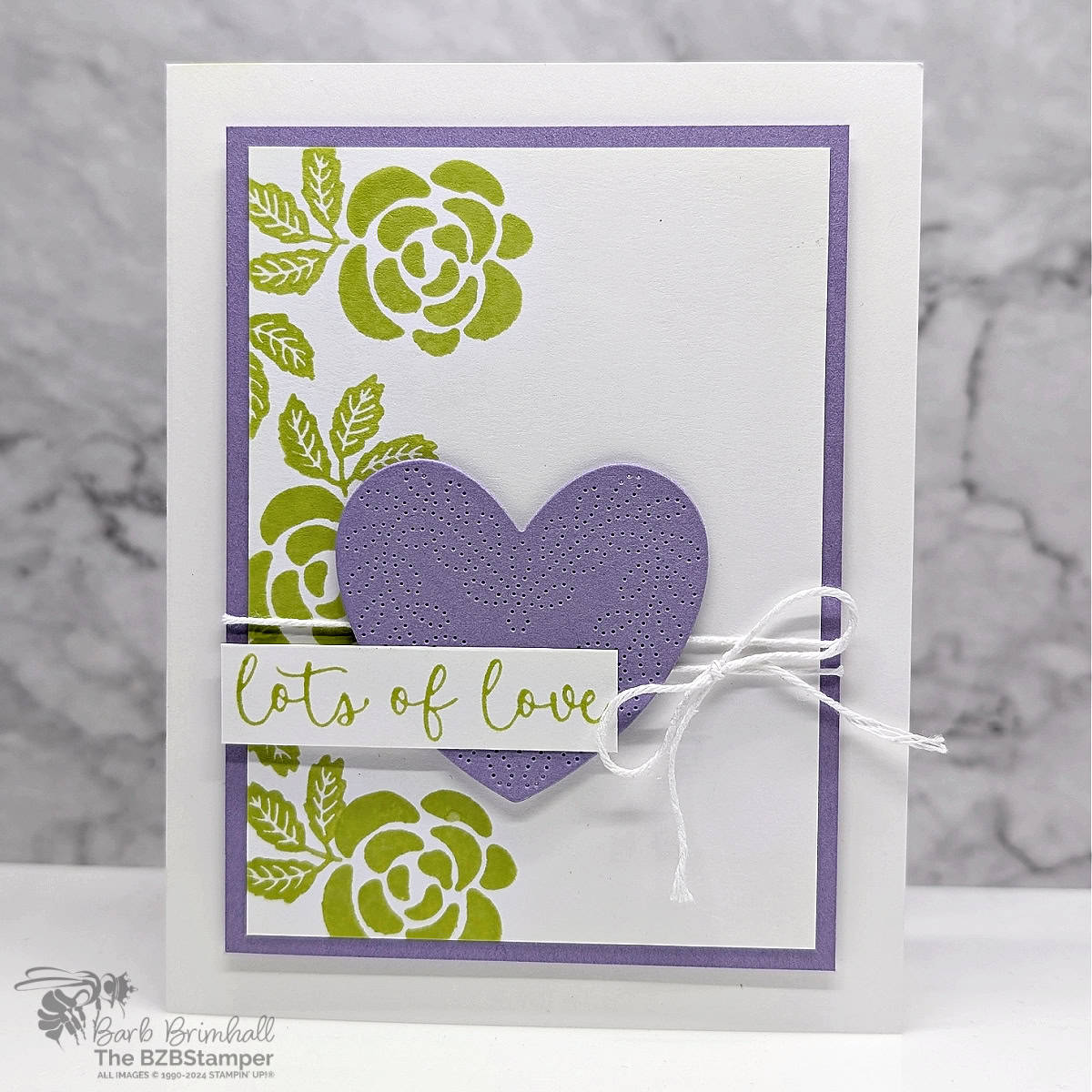 Sending Lots of Love with the Hearts of Elegance Bundle using green flowers and leaves and a purple die-cut heart. Sentiment is "lots of love".