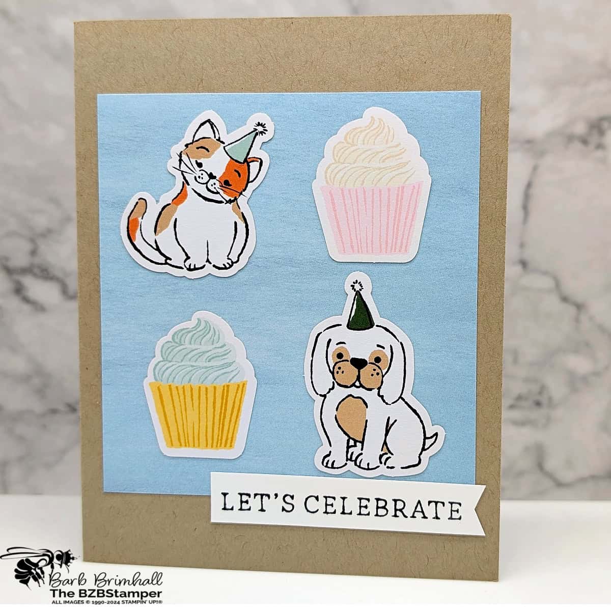 Lets Celebrate Card using Holiday Card Sketch 9 in pastels with a kraft base card, featuring a kitty, dog, and 2 cupcakes. 