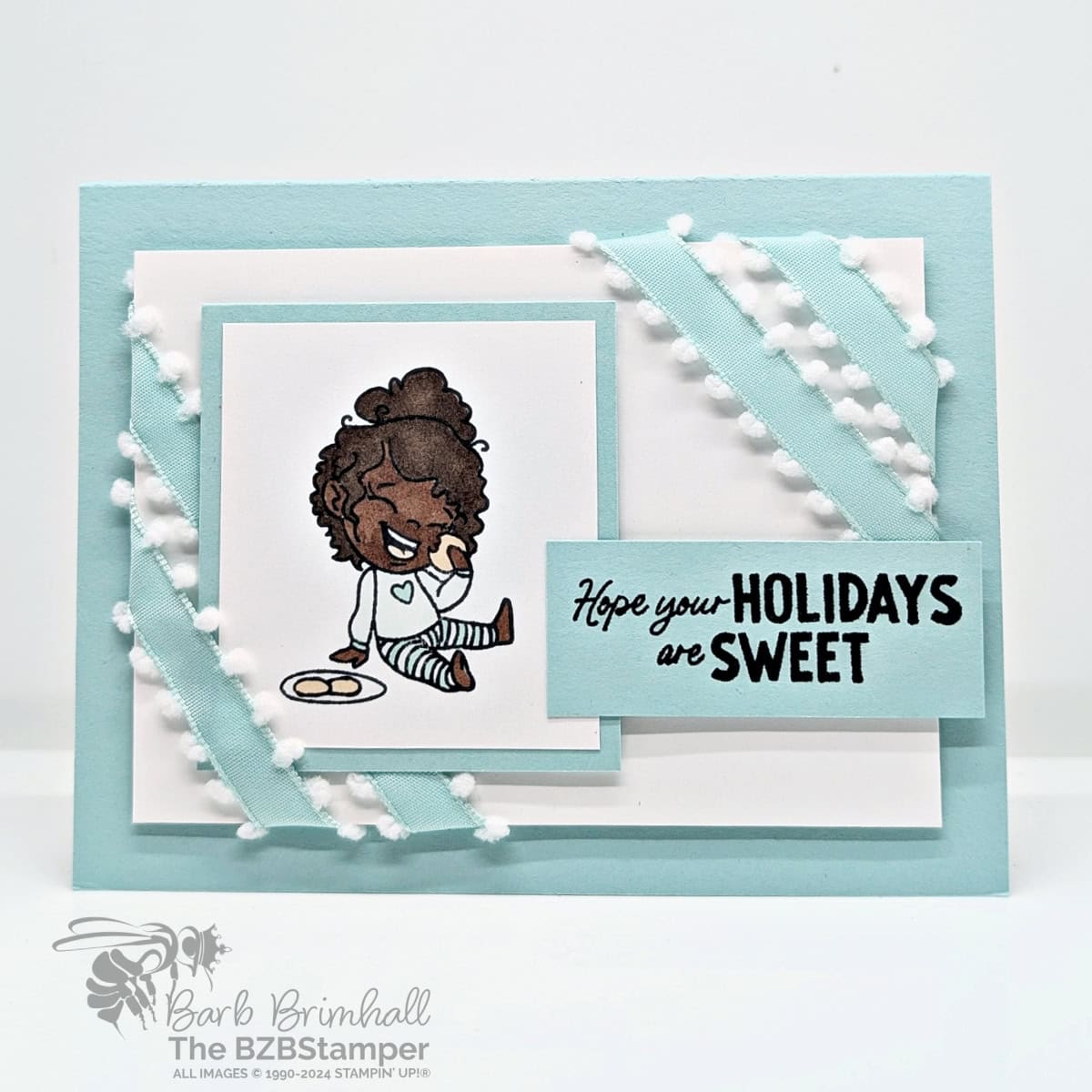 Sweet Holiday Cards with the Dear Santa Stamp Set featuring a girl eating cookies in blues with blue pompom ribbon and a "hope your holidays are sweet" sentiment.