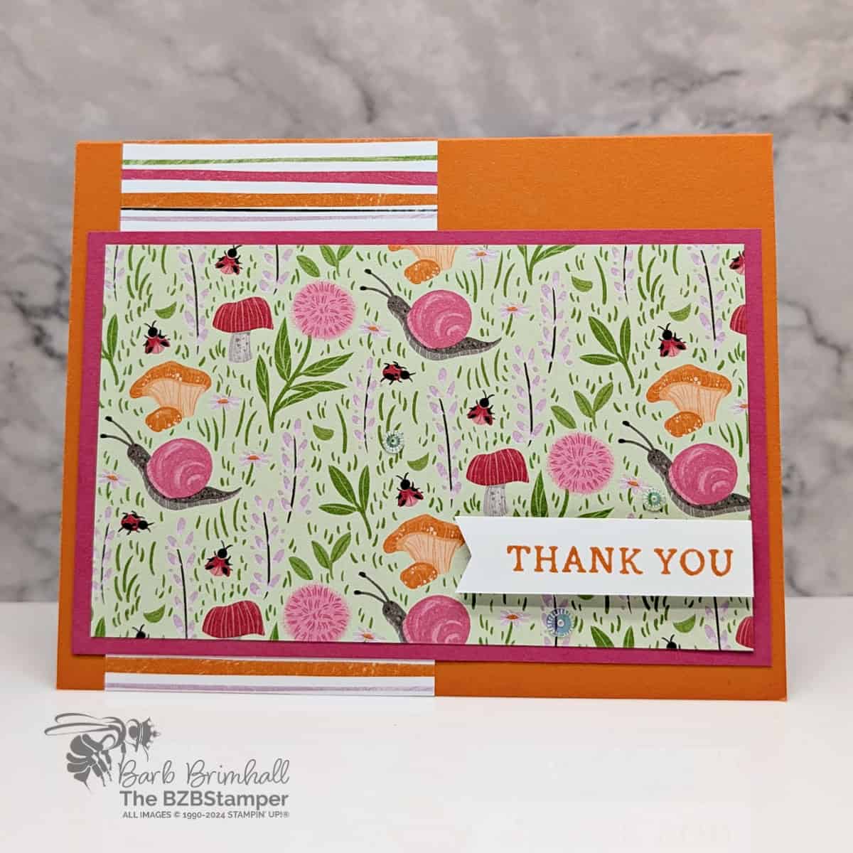 Quick and Easy Toadstools Garden Card featuring the whimsical Toadstools Garden paper in oranges and pinks and a thank you sentiment.