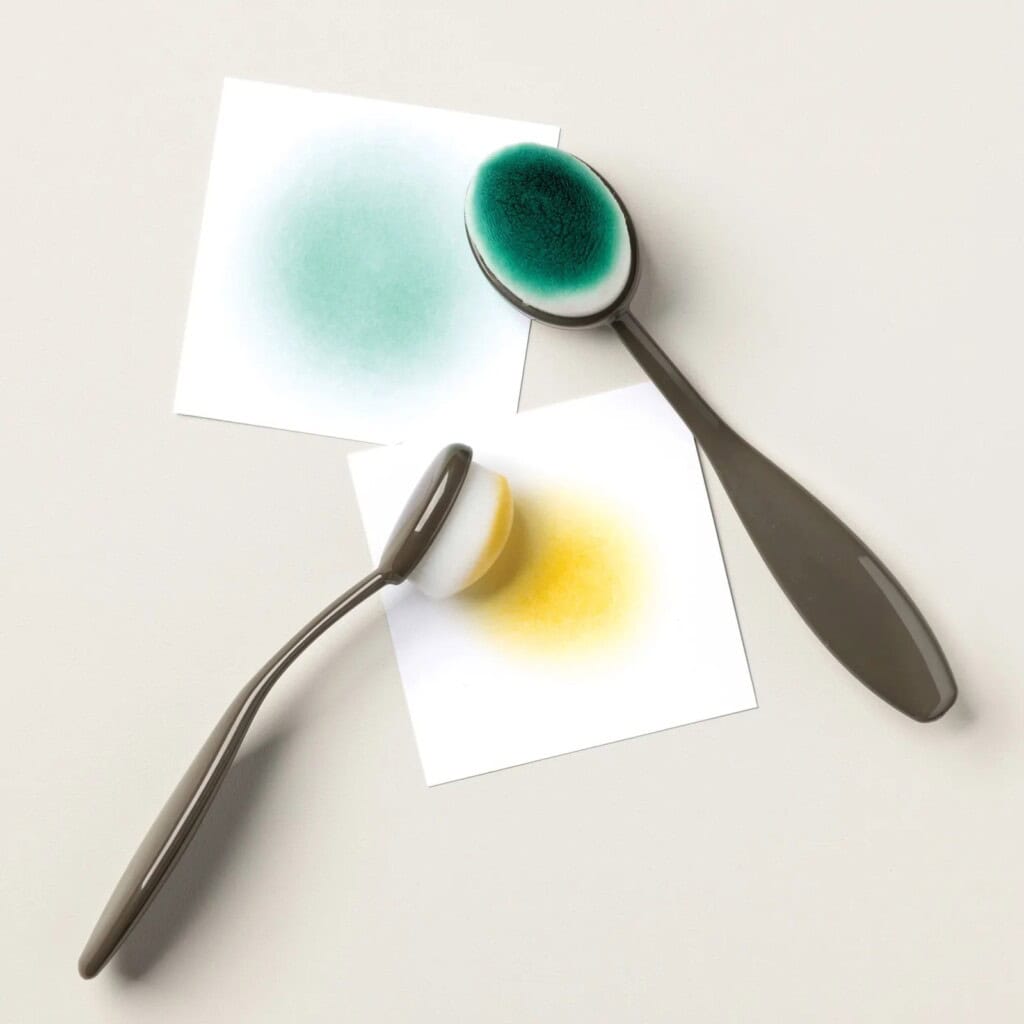 How to Use Stampin' Up! Blending Brushes tampin’ Up! Blending Brushes applying yellow and green ink onto cardstock, demonstrating smooth color blending for cardmaking backgrounds.