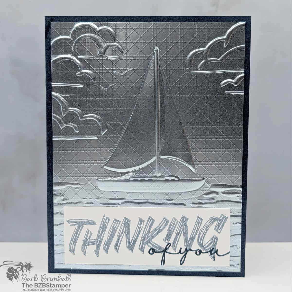 Layered Thoughts Thinking of You Card 1 Layered Thoughts Thinking of You Card in blues and silver foil, featuring an embossed sailboat and a "thinking of you" sentiment.