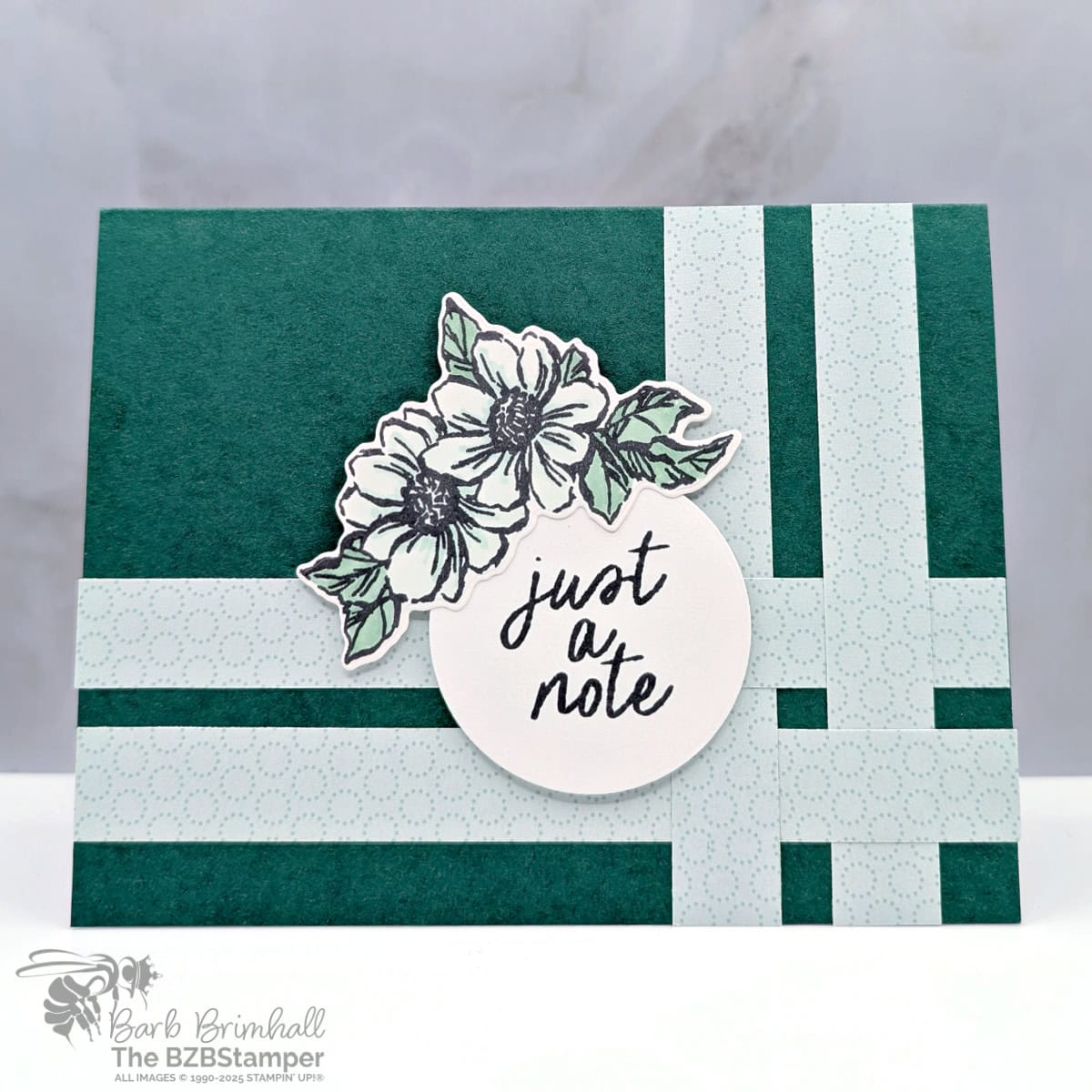 Elegant All Occasion Card Using the Gallery Blooms Bundle in greens and blues, with pretty paper strips and a die-cut flower and a "just a note" sentiment in a circle.