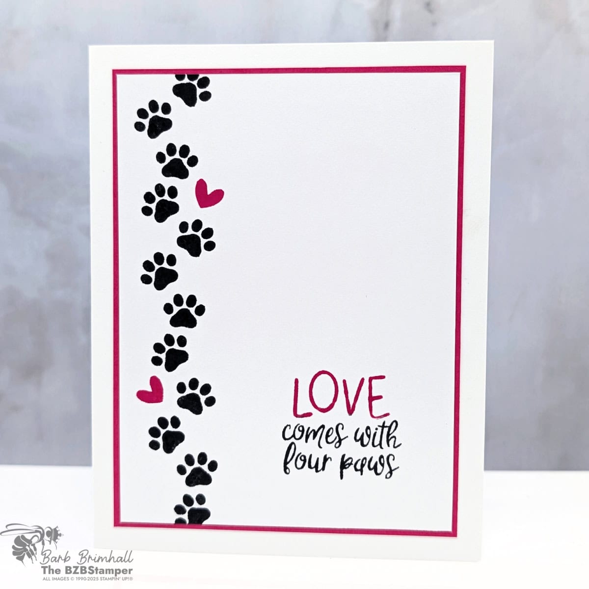 Handmade Pet Card with the Pet Love Stamp Set features a handmade pet card featuring black paw prints and pink hearts with the sentiment “Love comes with four paws."