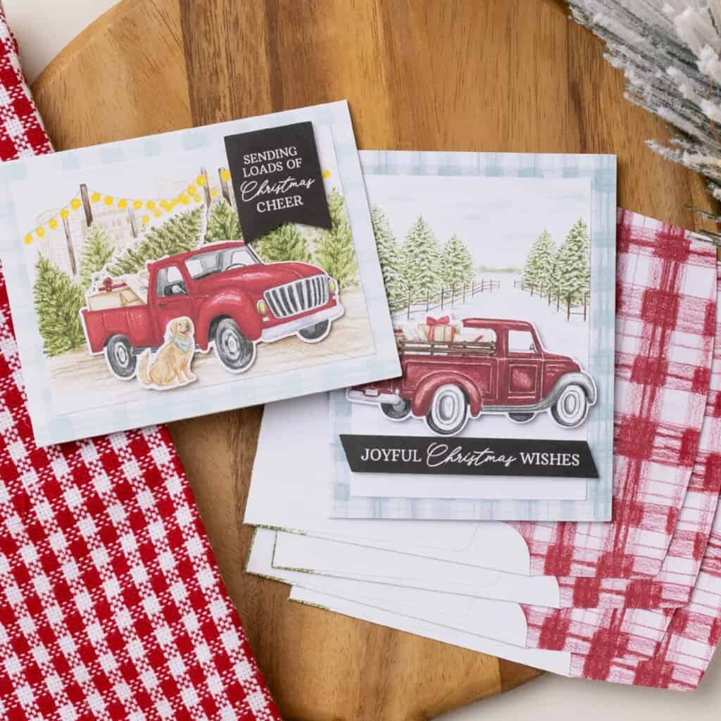 Road To Christmas Card Kit featuring handmade Christmas cards with a vintage red truck, snowy tree farm backgrounds, and festive preprinted sentiments.