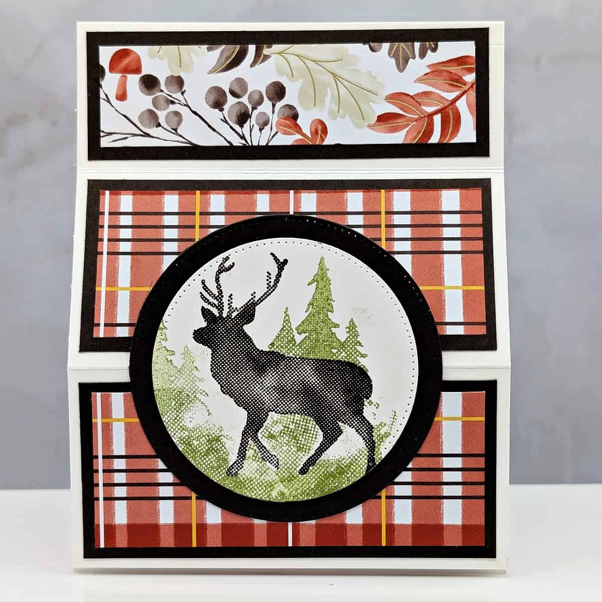 Coffee and a Card with the Outdoor Adventure Set Handmade masculine fun-fold card created with the Outdoor Adventure Stamp Set by Stampin’ Up!®, featuring a deer silhouette and plaid background in Cajun Craze and Early Espresso.