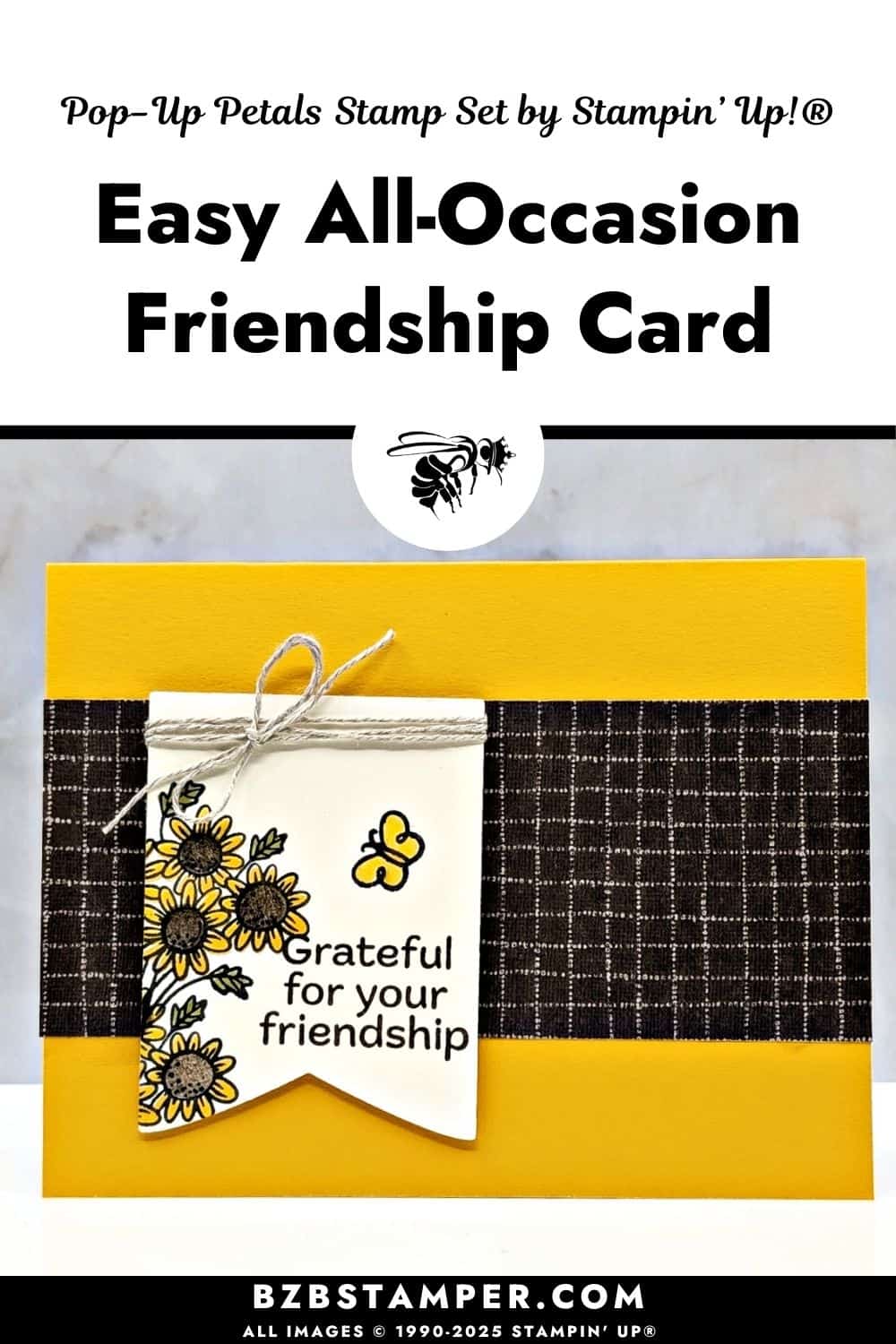 A handmade friendship card with a bright golden-yellow background. A wide strip of dark brown patterned paper runs across the center. On top of it hangs a small white tag, tied at the top with light twine. The tag is stamped with a cluster of simple sunflower-style blooms colored in yellow with green leaves, a small yellow butterfly, and the greeting &ldquo;Grateful for your friendship.&rdquo; The look is warm, cheerful, and clean, with the flowers spilling slightly off the left edge of the tag.