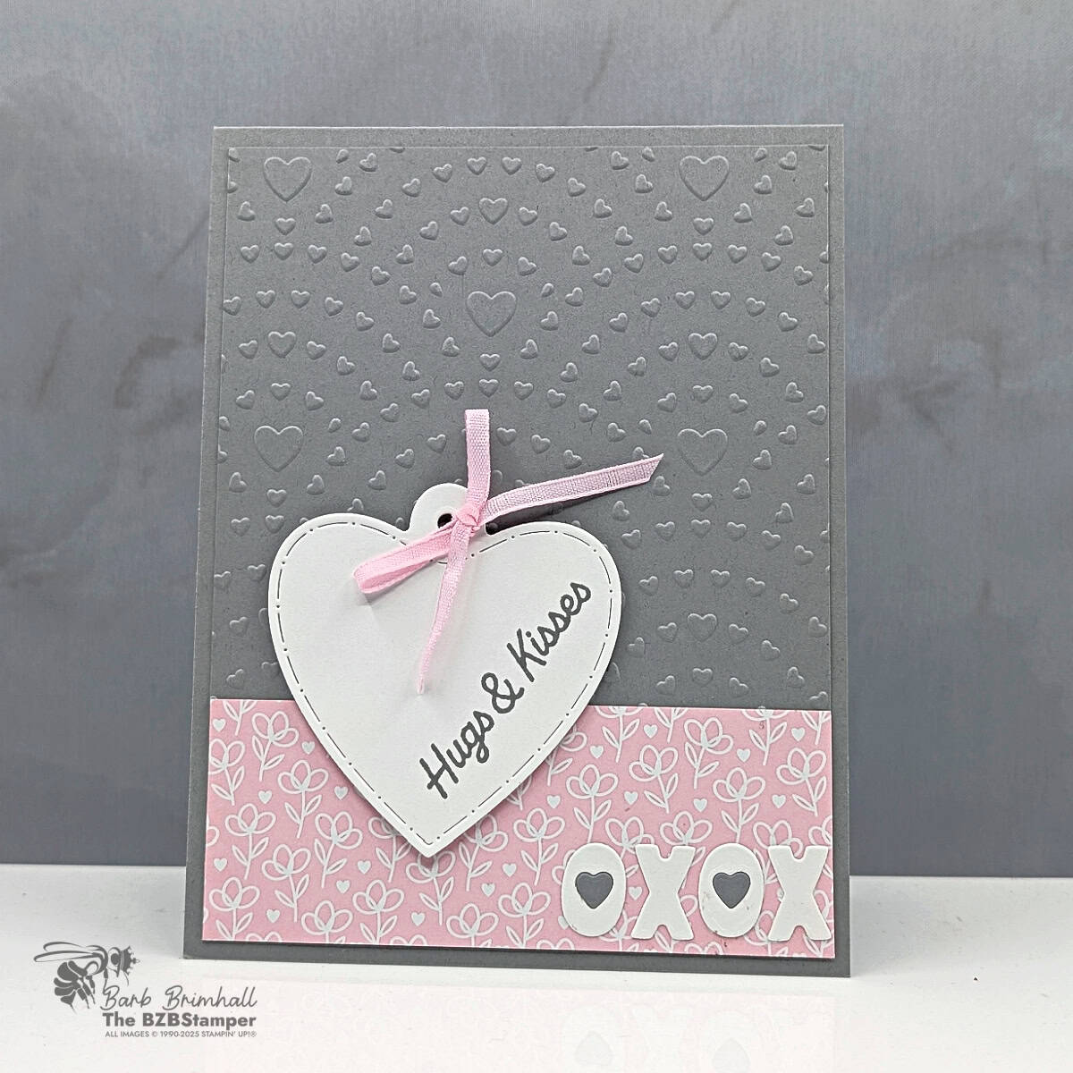 Heart-themed handmade greeting card with "Hugs & Kisses" message and pink ribbon bow, designed by Barb Brimhall of The BZBStamper.