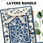 Delightful handmade layered card using fragrant layers with floral design and intricate cutout detail.