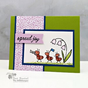 Cute handmade greeting card featuring whimsical ants and floral design with uplifting "spread joy" message.