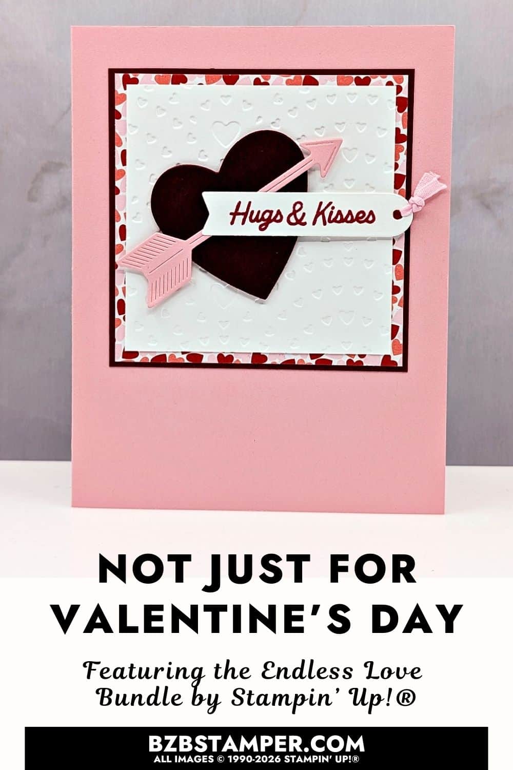 Die-Cut Valentine Card Using the Endless Love Bundle features a soft pink background and layered square panels in white, red, and pink. A dark red heart sits in the center with a pale pink arrow layered across it. The background panel has a raised heart texture, and a small sentiment tag with pink ribbon is attached, creating a romantic and dimensional look.